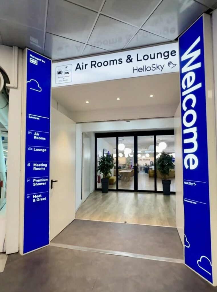 Entrance to HelloSky Air Rooms and Lounge with blue welcome signs.