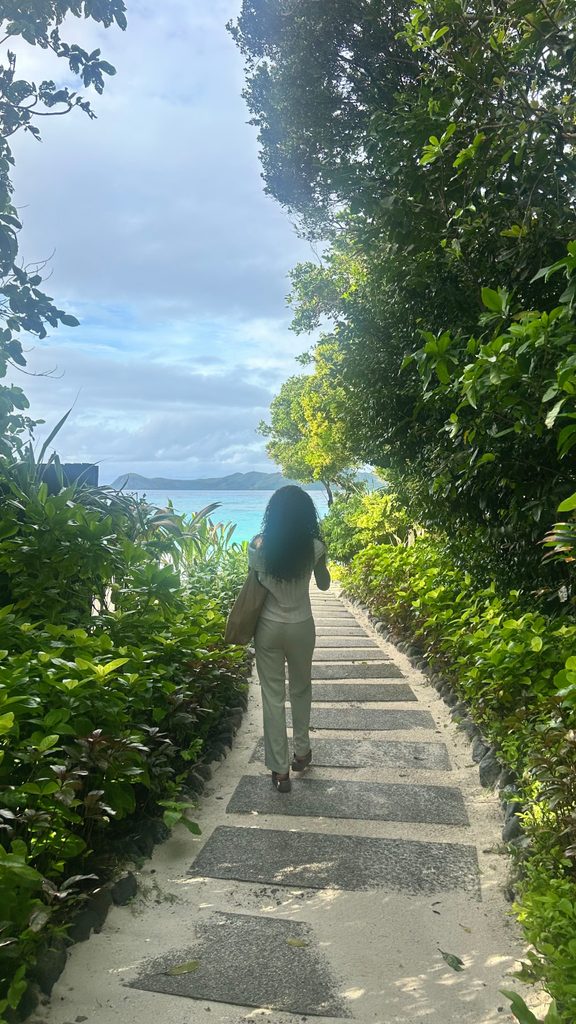 Opening / personal stay - Rita walking down the steps toward the beach.
